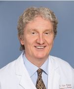 Dr. Olichney in a white coat