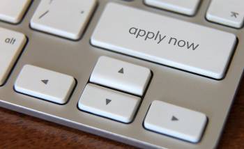Apply now button on a computer keyboard