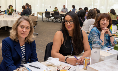 Betty Irene Moore Fellows Virginia LeBaron and Michelle Litchman sit with Susan Reinhard, visiting professor with the fellowship program and Fellowship National Advisory Council member, during a Convocation 2023 event. (c) UC Regents. All rights reserved.