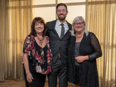 Susan C. Reinhard poses with Betty Irene Moore Fellow J. Nicholas Odom and Fellowship National Program Director Heather M. Young. (c) UC Regents. All rights reserved.