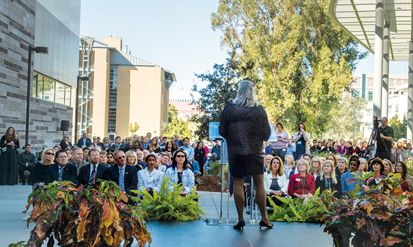 Founding Dean Heather M. Young opens the ribbon cutting ceremony.