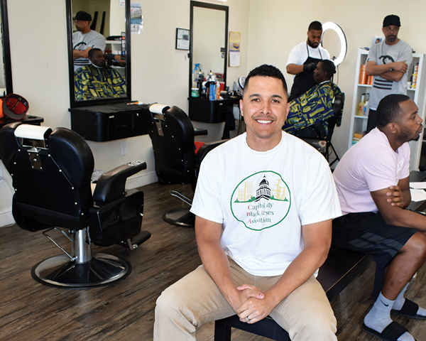 Carter Todd took his master’s thesis project into African American barbershops, such as Upgrade Cuts and Styles, to interview male patrons about their perceptions of the nursing profession.