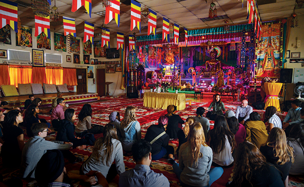 Participants of the 2019 Central Valley bus trip visited Wat Dhammararam, a Cambodian Buddhist Temple, during the two-day tour. Associate Clinical Professor Jann Murray-García leads the tour (below, with megaphone).