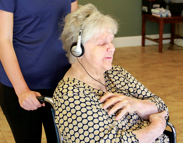 Ruth Roenspie enjoys listening to music at Eskaton Care Center Manzanita. She’s one of more than 4,000 nursing home residents who tested if use of the Music & Memory program reduced either aggressive behavior or the need for medication.