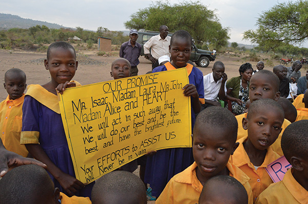 Kenyan students holding up sign