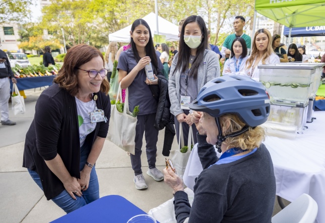 a woman participating in a bicycle helmet fitting