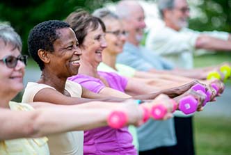 group of healthy seniors exercising, stock