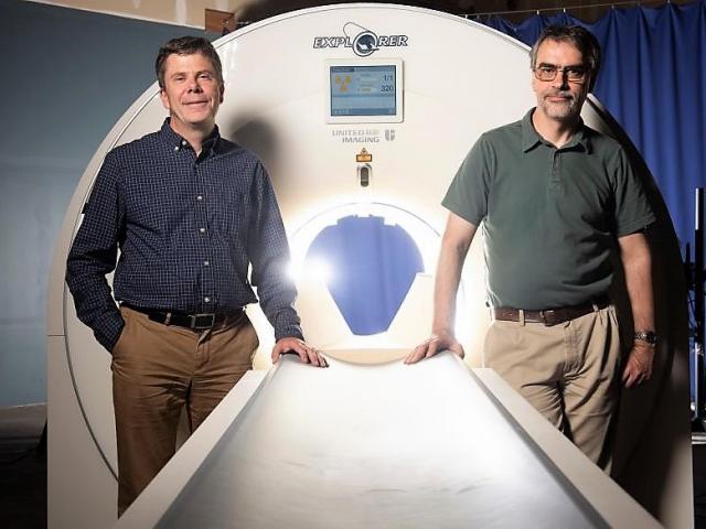 Drs Badawi and Cherry with the Explorer PET scanner