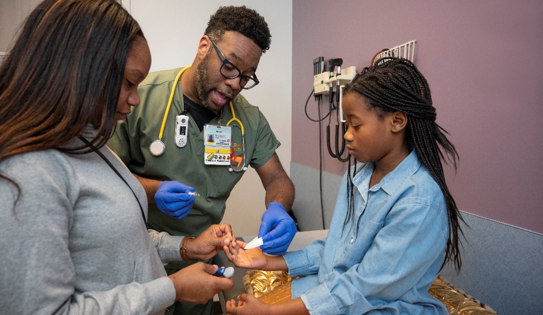 doctor treating young girl