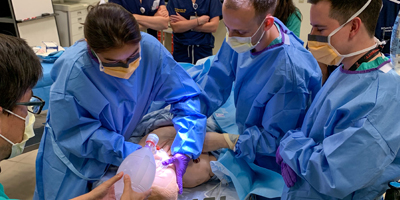 Physicians practice ENT skills during simulations. (C) UC Davis Regents.
