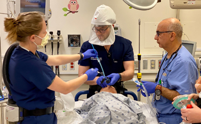 Clinicians training in-situ in the ER with a mannequin. (C) UC Davis Regents.