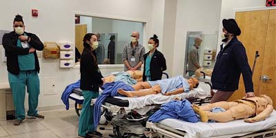 Fellows practice trauma surgery skills during simulations. (C) UC Davis Regents