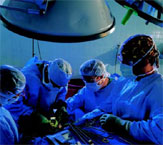 PHOTO -- Surgeon Vijay Khatri, far right, leads the nonsurgical lumpectomy trial at UC Davis Cancer Center