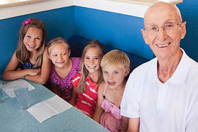 Albert Plante enjoying ice cream with his grandchildren