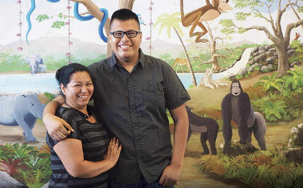 Melvin Florencio and mother, Ofelia, in the UC Davis Comprehensive Cancer Center’s pediatric infusion center.