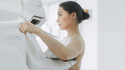 Woman in 3d mammogram machine