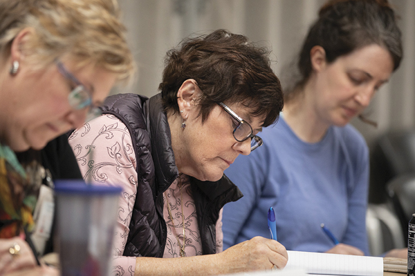Cheryl Paletz, center, during Writing as Healing workshop session.