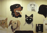 PHOTO -- More than half of all dogs and cats that live past age 10 will develop cancer. Thousands come to the UC Davis Small Animal Hospital every year for treatment, passing this mural in the lobby.