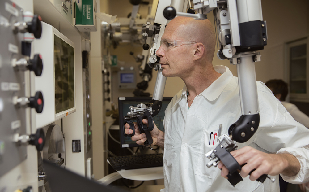 Post-doctoral researcher Sven Hausner performs remote synthesis of radioactive imaging agent.