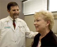 PHOTO — Lloyd Smith's research showed that detecting ovarian cancer early can happen more frequently as long as physicians listen carefully for patient reports of symptoms like abdominal swelling and pain when they are still mild. His patient, Sharon Ogden, was diagnosed when her ovarian cancer was at stage 1, allowing her to begin treatments when they can be most beneficial.